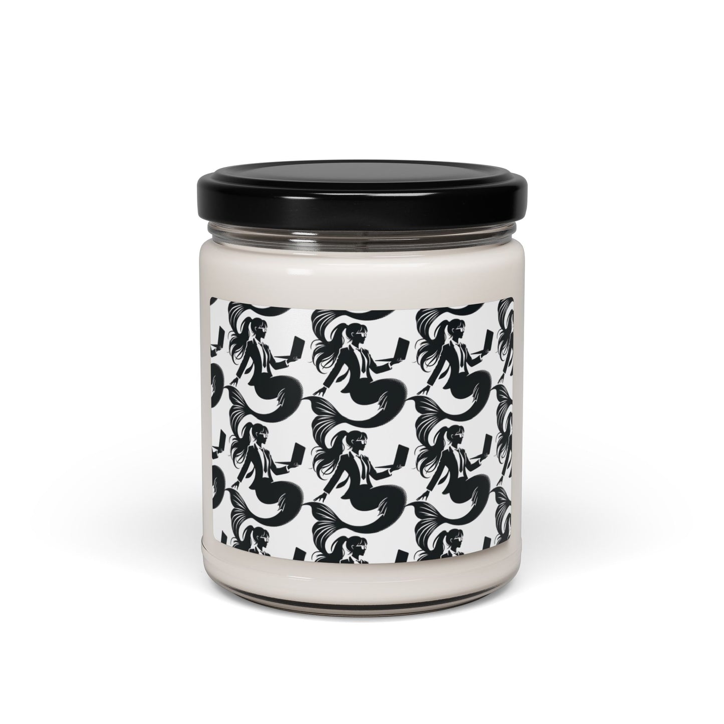 Corporate mermaids on a soy candle glass jar with black lid. The corporate mermaid design is a black and white mermaid wearing a suit, glasses and hair in a ponytail, holding an open laptop. 