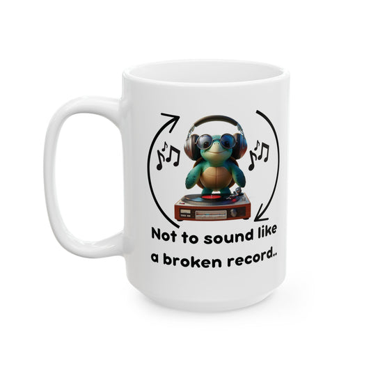 A white ceramic coffee mug with some corporate jargon, Not to Sound Like a Broken Record, which is in bubble letters, above it is a turtle dj with arrows indicating he may be stuck on repeat. Front.