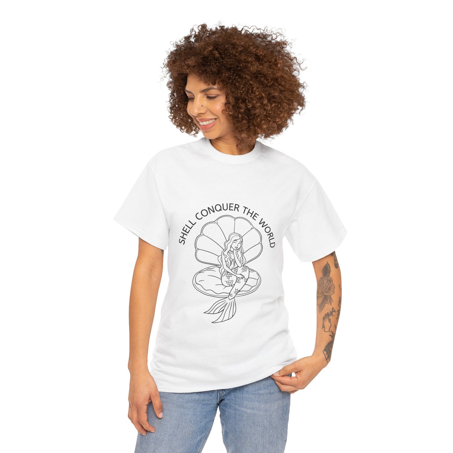 White unisex short sleeve t-shirt worn by a female with a mermaid sitting in an open oyster shell, with the words "SHELL CONQUER THE WORLD" written in an arc above the image. 